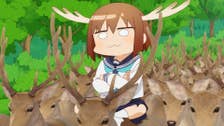 An anime girl with a silly expression on her face and antlers attached to her head riding a herd of realistic looking deer.