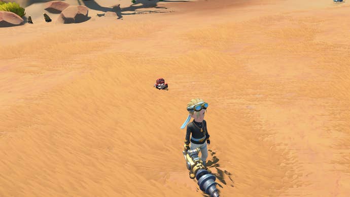 My Time at Sandrock Agate: An animated man with blonde hair is standing in a beige grassy field near a chunk of red agate