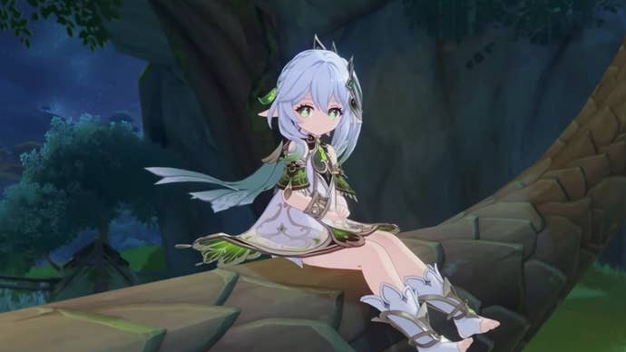 Genshin Impact Nahida teams: An anime girl in a green and silver dress is sitting on a large tree branch