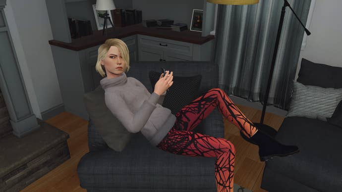 A screenshot of a young white woman with blonde hair and orangey-red leggings, sprawling in an armchair, from the game Nancy Drew: Midnight In Salem