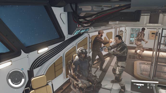 A spaceship cockpit in Starfield with supposedly hostile NPCs scattered around refusing to open fire.