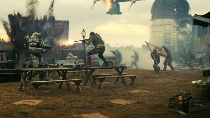 A gunfight between the NCR and the Brotherhood of Steel in Amazon’s Fallout TV series. One soldier is carrying the NCR flag