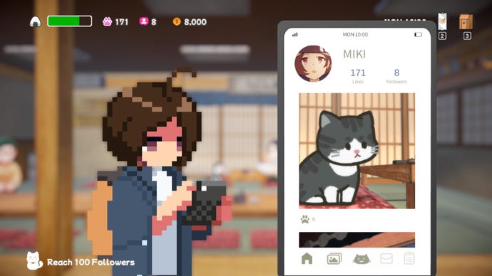 Miki looks at her phone, which shows a picture of a cat sat in a ramen restaurant on her social media feed.