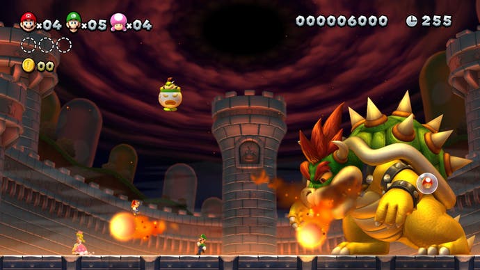 Best Mario Games - New Super Mario Bros. Deluxe screenshot showing Mario fighting a gigantic Bowser at his castle.