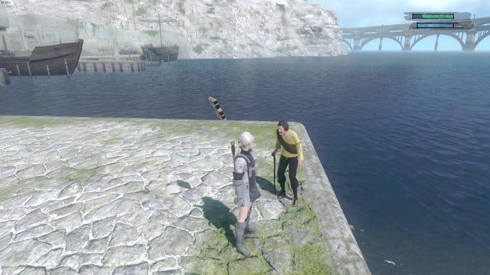 I stand next to a hunched over old man who has his back turned to the sea. A large, rusted bridge rises out from surf.