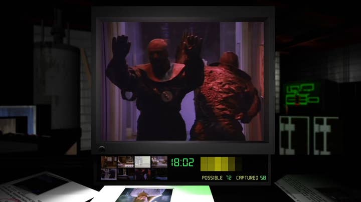 Night Trap screen showing a video clip of two people in cheesy monster costumes with much of the screen taken up by a mostly static rendering of a video editing program on computer monitor on a desk.