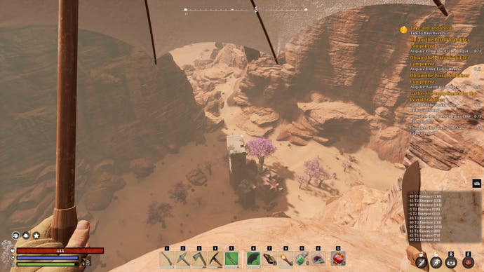 Looking over the side of a desert cliff in Nightingale, ready to glide down by umbrella.