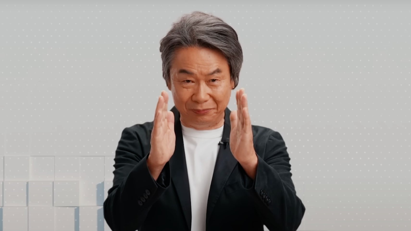 Shigeru Miyamoto doing his 'directly' hand signal as he announces Nintendo Today. - 1