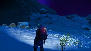 No Man's Sky - The player stands on a dark and snowy planet alone.