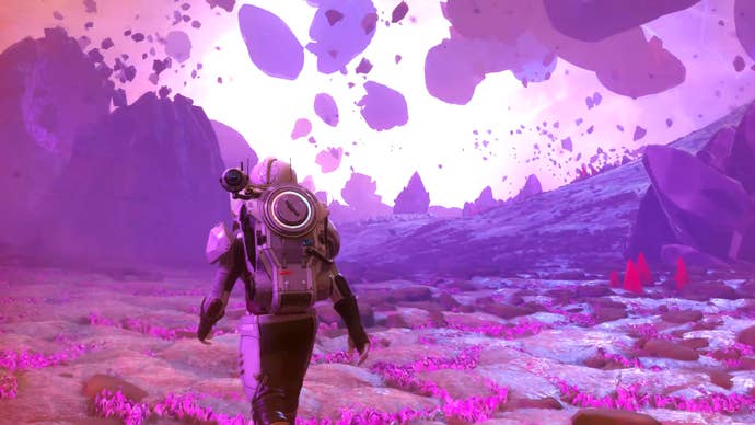 A shot from No Man’s Sky’s Worlds Part 2 update trailer showing a player exploring the surface of a purple-hued gas giant as huge rocks swirl around above their head.