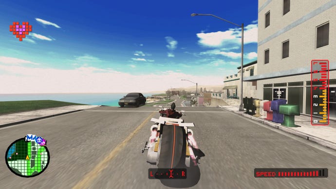 A screenshot from No More Heroes which shows Travis on his bike, cruising down a road with a blue sky above and the beach to his left.