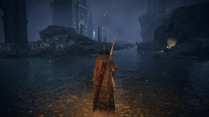 A warrior stands in ankle-high water looking at underground ruins in Nokstella in Elden Ring