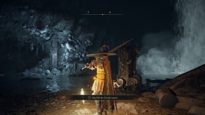 A warrior stands next to a site of grace in an underground lake in Nokstella in Elden Ring