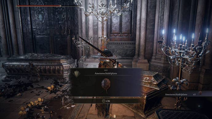 A warrior opens a treasure chest to get the Ant’s Plate Armour in Nokstella in Elden Ring