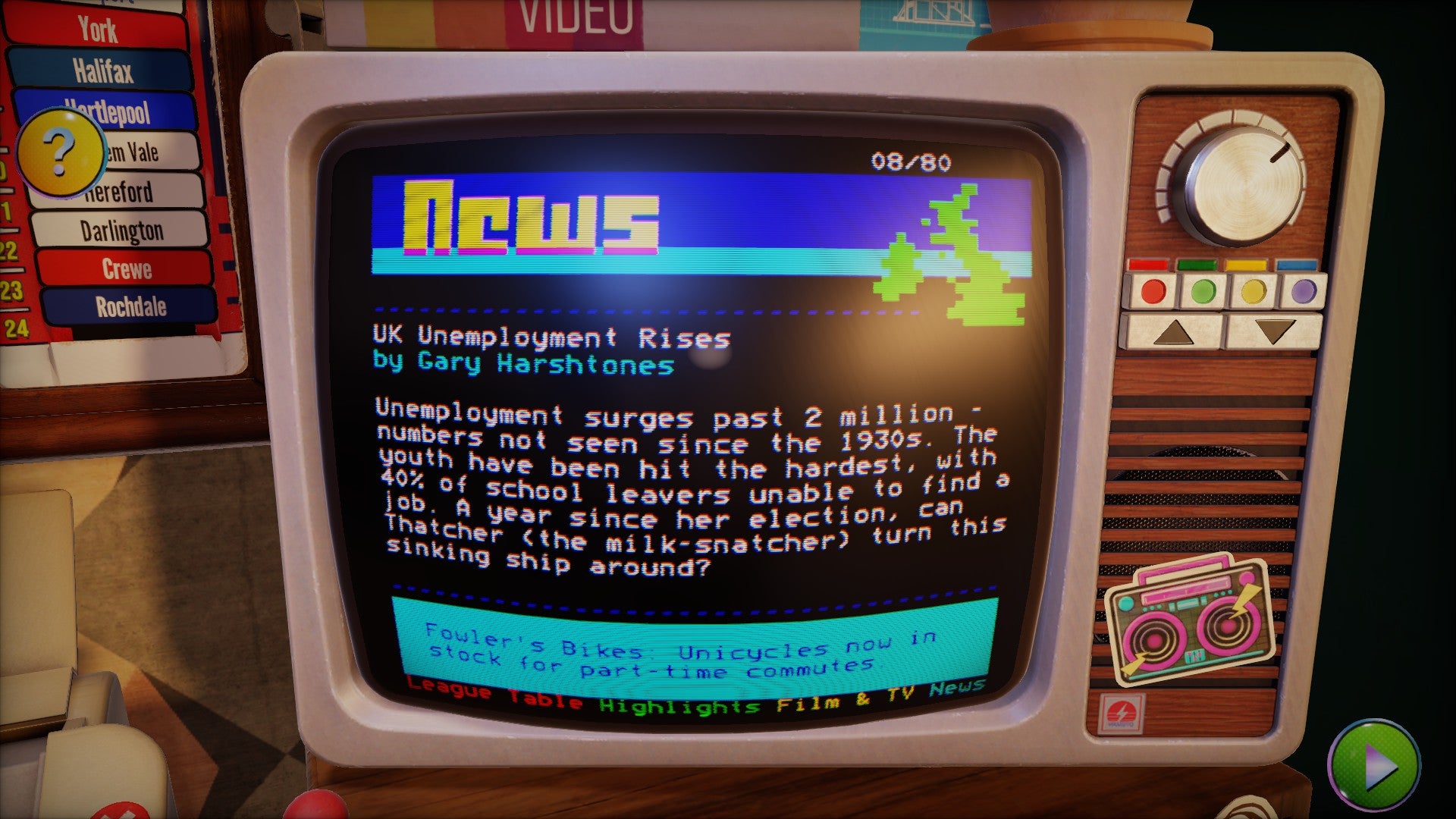 An old-style TV screen with ceefax running on it - a low-resolution text screen showing today's news. Think: the internet, but in the 1980s.