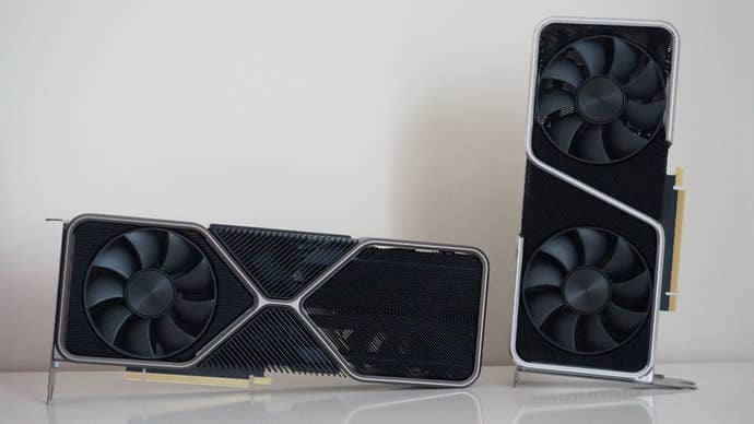 A photo of Nvidia’s GeForce RTX 3080 Founders Edition graphics card next to the RTX 3070 Founders Edition