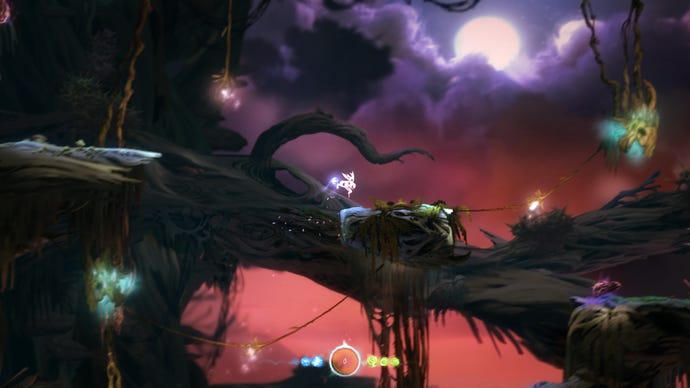 A small white woodland sprite jumps across a forest scene in Ori And The Blind Forest
