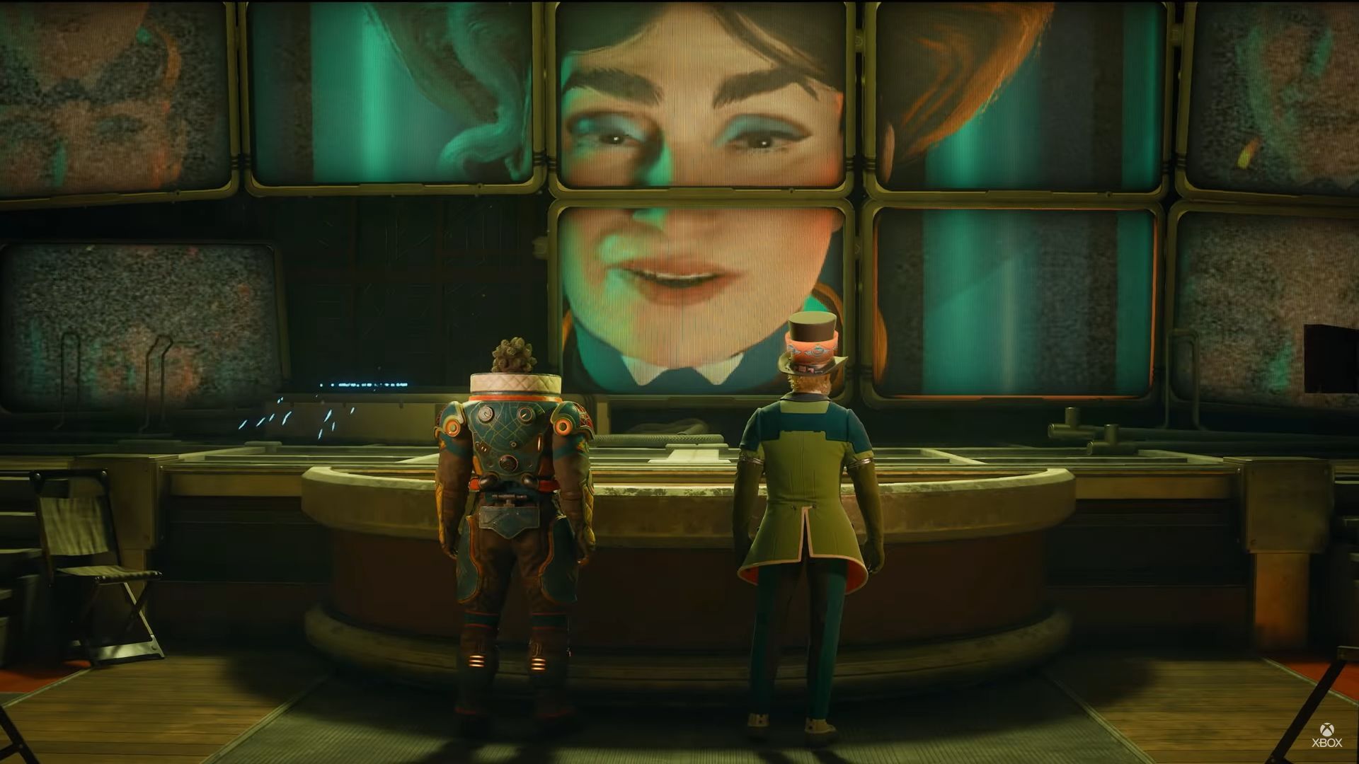 Two soldiers consult a slope of screens connected which their motherly CEO gives orders.