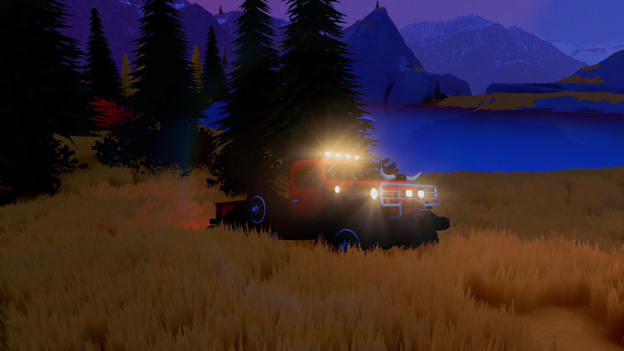 A pickup truck drives near a lake at night in Over the Hill.
