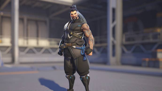 Hanzo, a hero in Overwatch 2, poses before the camera in the hero selection screen.