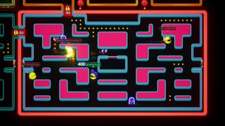 Players race around a pink Pac-Man maze in multiplayer battle royale game Pac-Man Mega Tunnel Battle: Chomp Champs