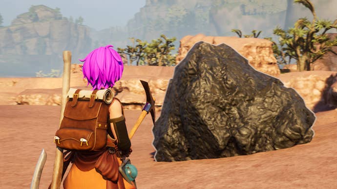 palworld character holding pickaxe facing coal lump in desert