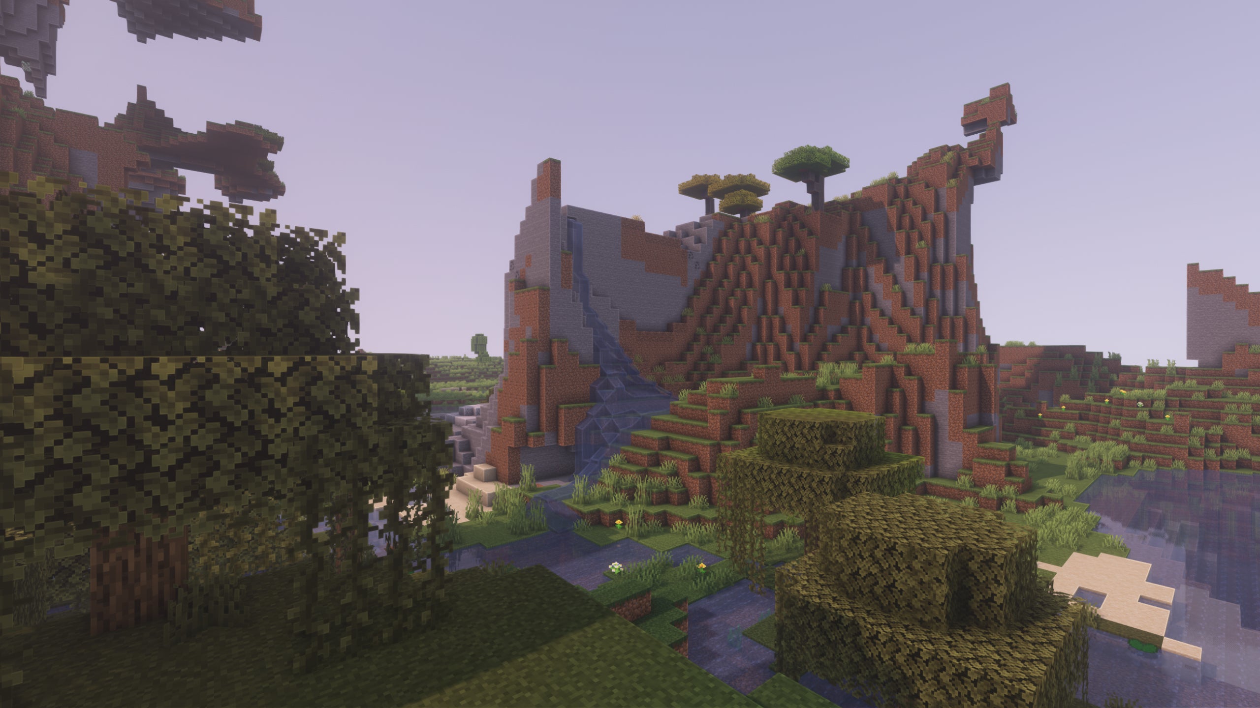 An extreme hills biome in Minecraft with Pastel Shaders installed.