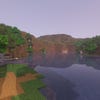 A screenshot of a river in Minecraft, with some trees on either side of the bank and a hill in the distance, taken using Pastel shaders.