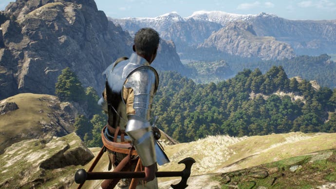 An armoured character stands on top of a cliff looking out across a forested valley.