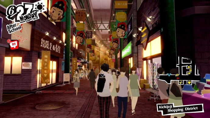 Joker strolls through the bustling Kichijoji, a new shopping district introduced in Persona 5 Royal.