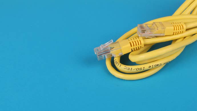 An unplugged yellow ethernet cable.