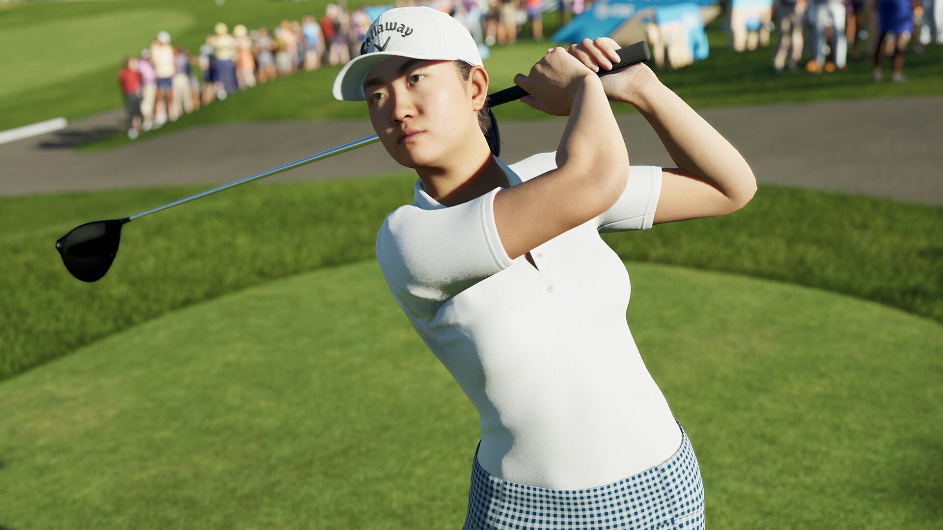 A female, Asian golfer in a white t-shirt on the green in PGA Tour 2K25 - 3