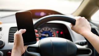 Any use of mobile devices while driving is now illegal in UK