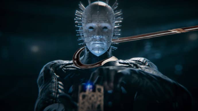 Dead by Daylight’s rendition of Pinhead staring into the camera while a shepherd’s crook comes in from the right of the frame and wraps around his neck.