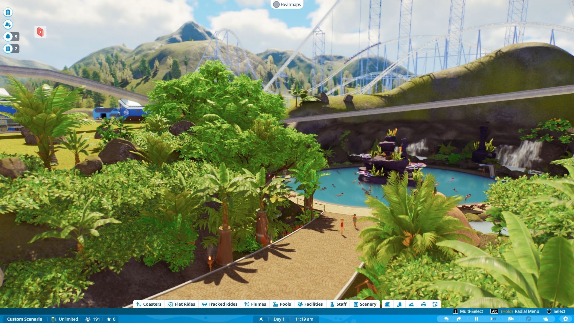 A path leading to a tropical themed pool, with a walkway suspended above it. - 4