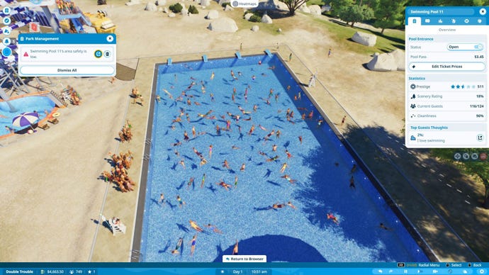 A large, long pool is filled with many swimmers on a hot day.