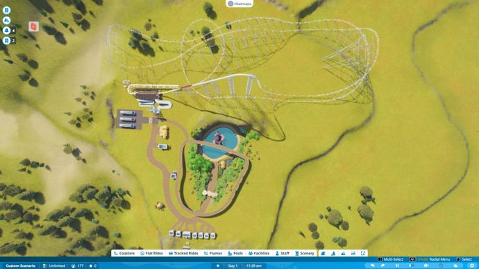 An aerial view of a park in-progress, featuring a tropical pool and a roller coaster.