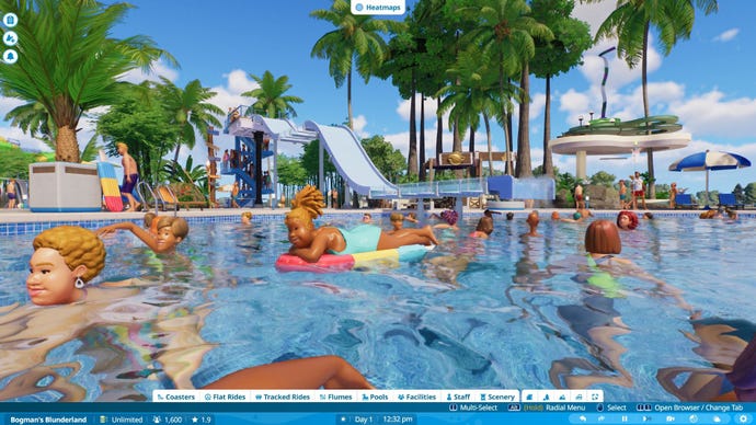 Guests relax in the pool with a body slide in the background.