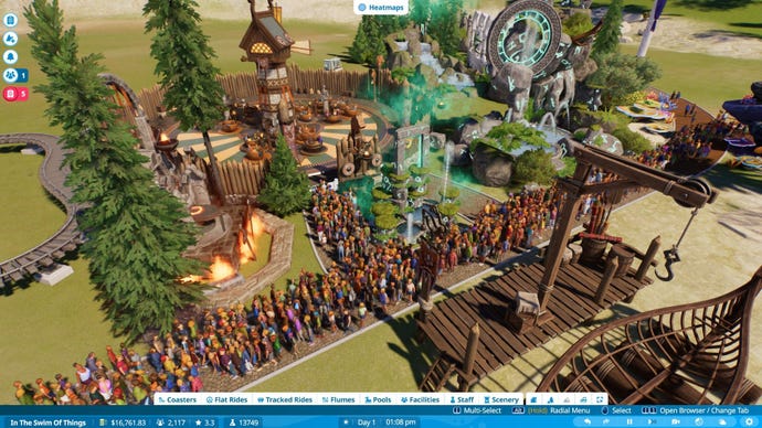 Crowds make a pathway congested outside a Viking themed ride.