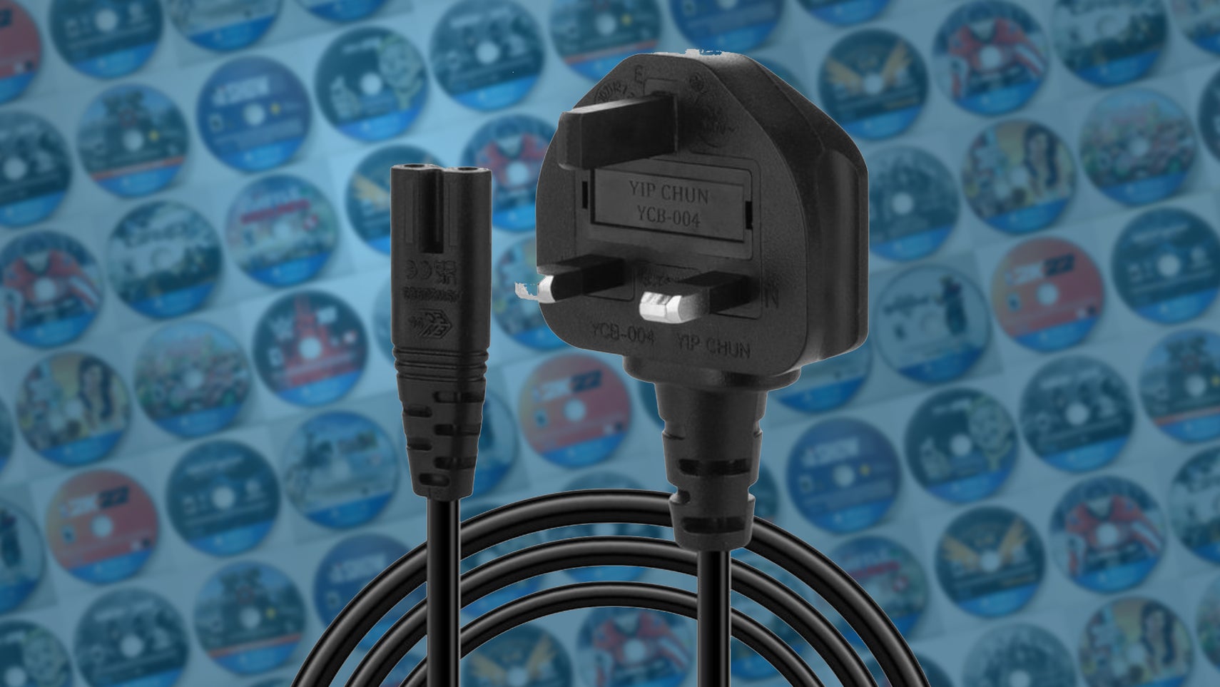 PlayStation 5 power plug over a grid of PS5 discs