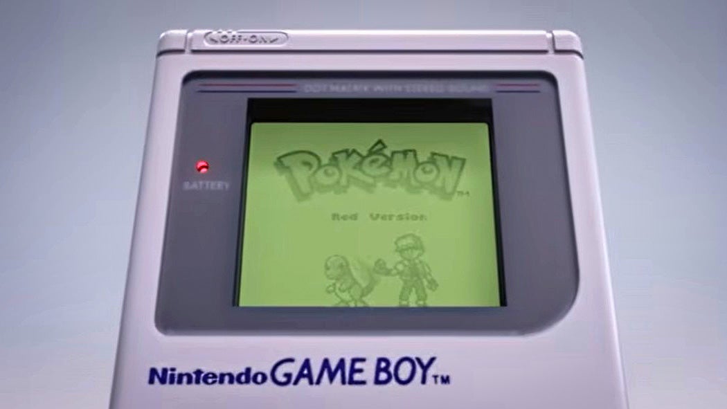 A Game Boy with Pokémon on the screen.