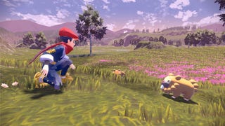 A Pokemon trainer crouches in front of a Bidoof on a grassy plain in Pokemon Legends Arceus