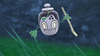 Pokemon Scarlet and Violet Poltchageist: A grey and charcoal pot with a painted-on face and green limbs faces the camera, with one hand holding a stick.