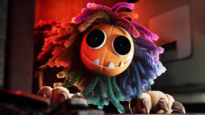 Image of Poppy Playtime Chapter Four villain Yarnaby, a yarn monster with big button eyes and a grin