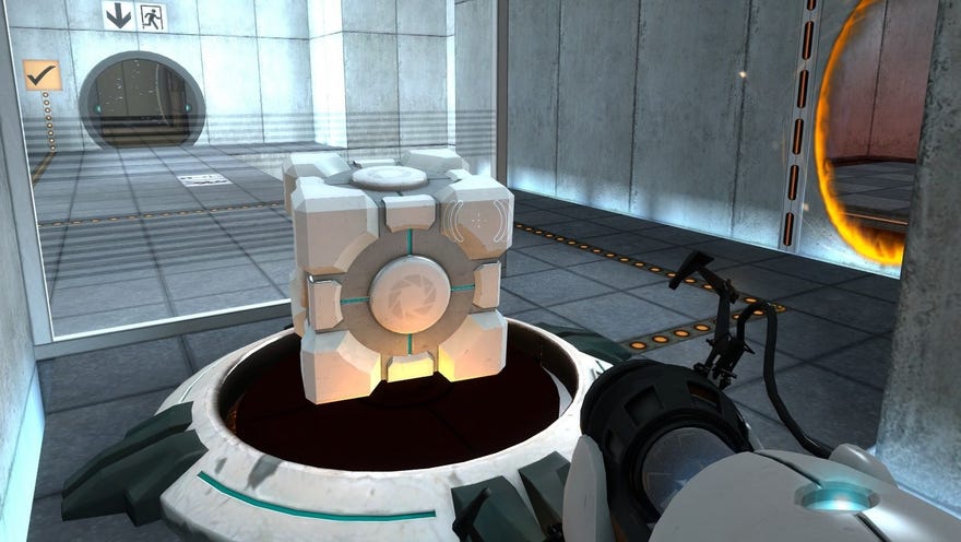 Portal - A player points their portal gun at a companion cube that’s been placed on top of a large button. An orange portal is open on a wall on their right.