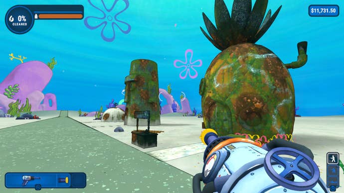 The houses of Bikini Bottom’s most famous residents: SpongeBob’s pineapple, Squidward’s stone head, and Patrick’s rock in PowerWash Simulator’s SpongeBob Squarepants DLC