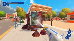 A player blasting water at a muddy road brushing car on a bright blue day in town, from PowerWash Simulator 2.