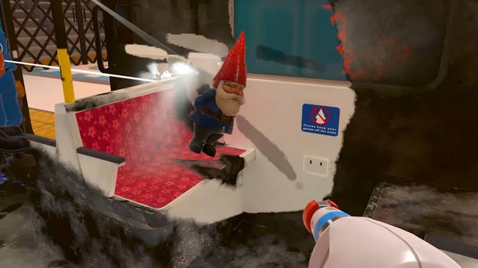 A first-person position of idiosyncratic utilizing a powerwasher to cleanable the wrong of a train, a gnome sitting connected 1 of the seats successful PowerWash Simulator.
