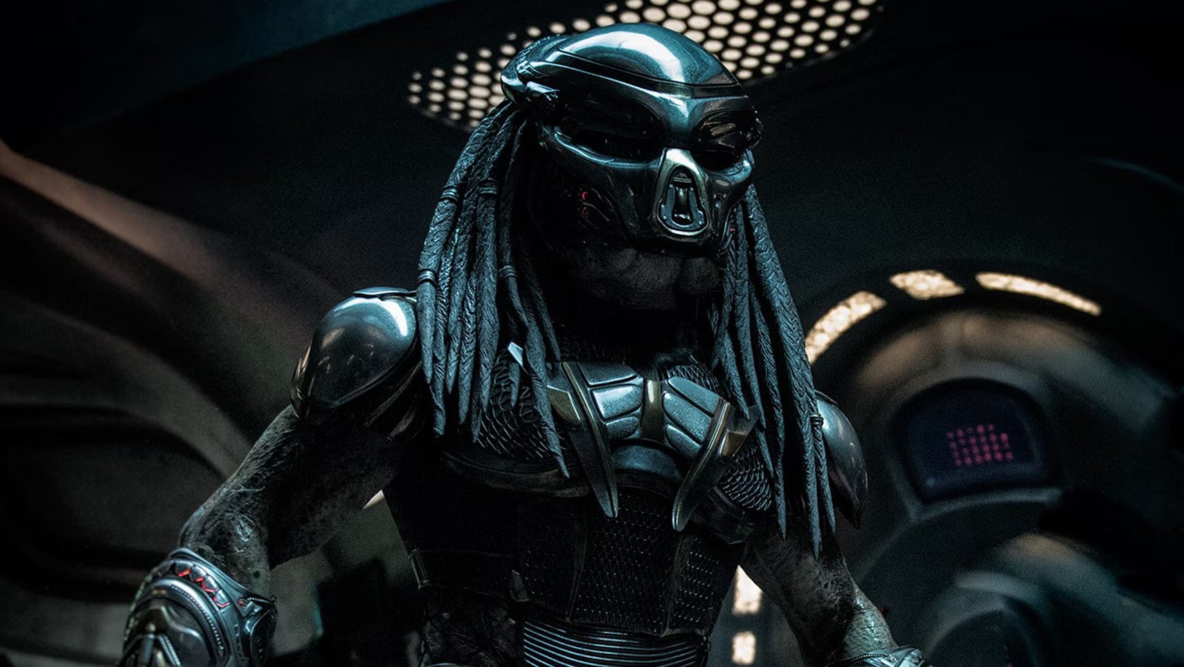 A Predator in a metallic, militaristic outfit in The Predator. - 1