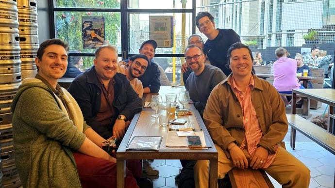 A photo of the author's Magic: the Gathering group sat around a pub table for its "AGM".